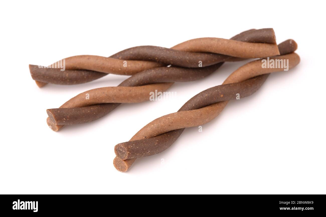 Twisted dog chew sticks isolated on white Stock Photo