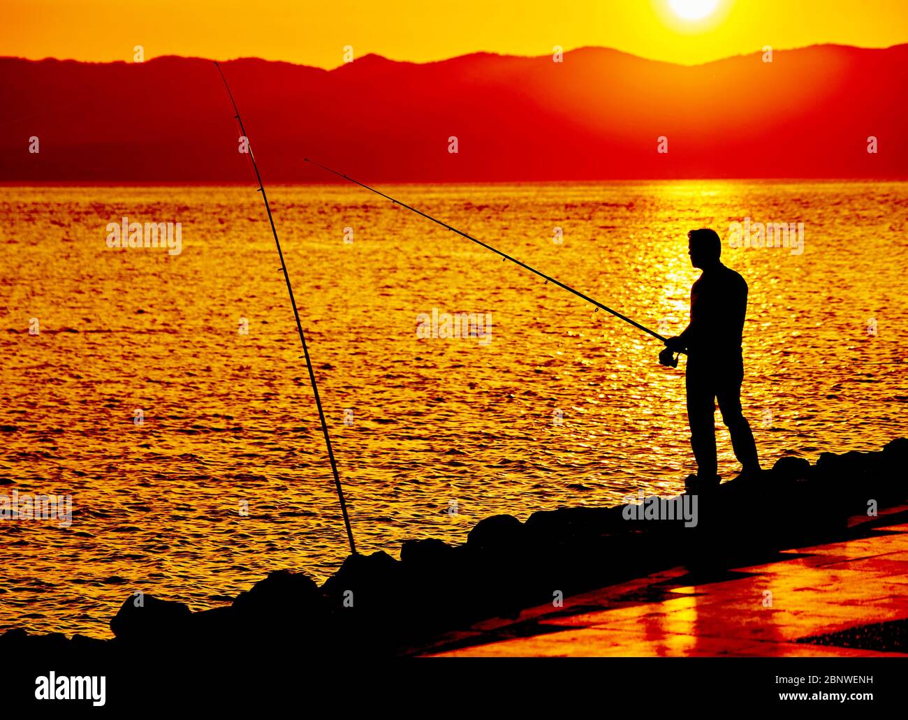 Man Fishing on Beach at Sunrise Editorial Photo - Image of adventure, mile:  194547321