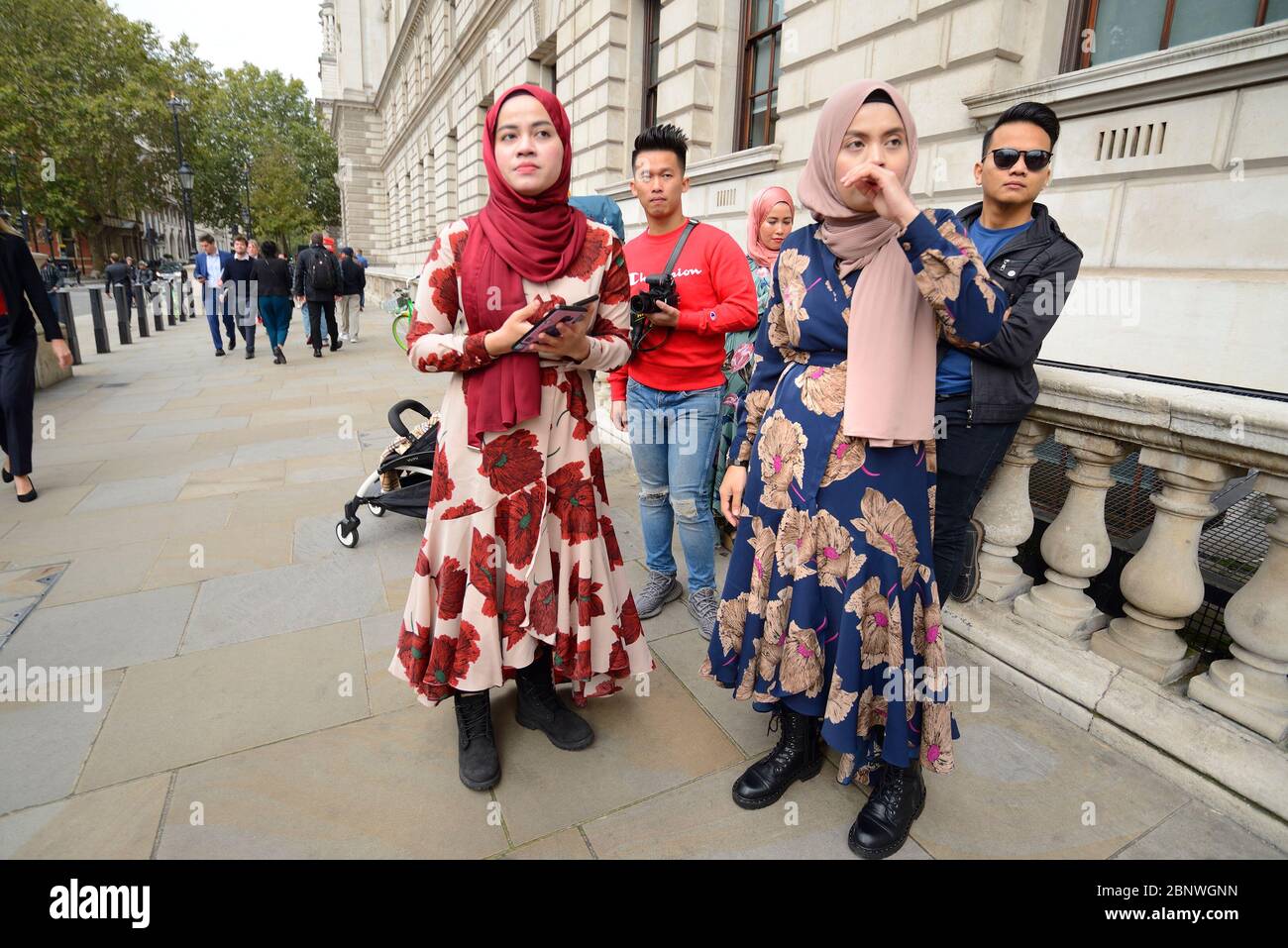 London, England, UK. Group of young Asian tourists in Whitehall Stock Photo