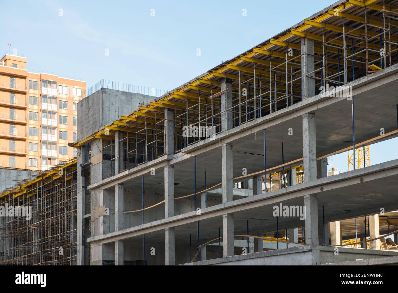 Scaffolding system on the construction new building. Development and real estate Stock Photo Alamy