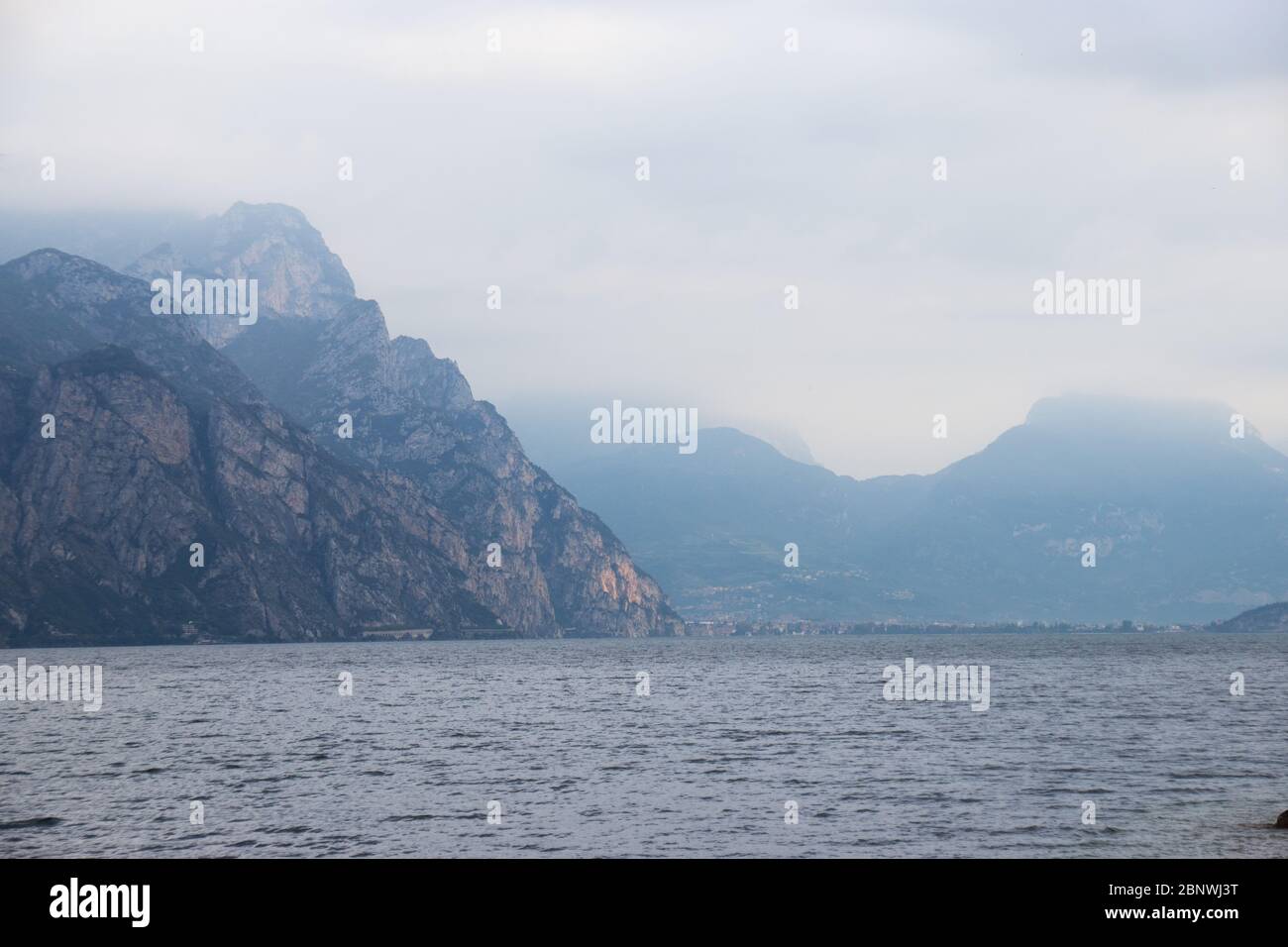 Cool and foggy autumn morning over lake Garda (Italy) Stock Photo