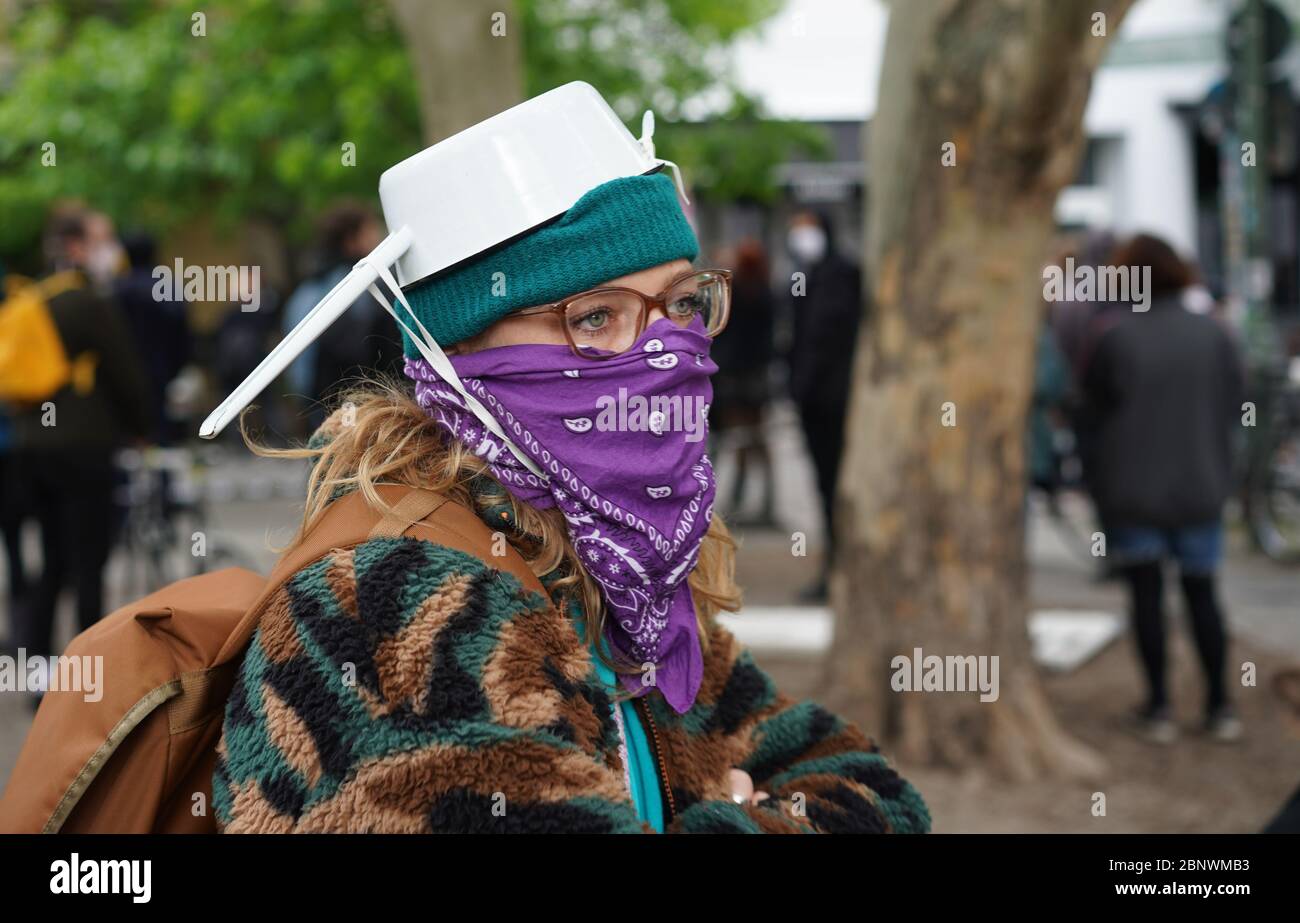 Berlin, Germany. 16th May, 2020. The participant of a small demonstration in the Schendelpark carries a cooking pot. Numerous demonstrations on the subject of corona and contact restrictions and counter-demonstrations take place in the city today. Credit: Jörg Carstensen/dpa/Alamy Live News Stock Photo