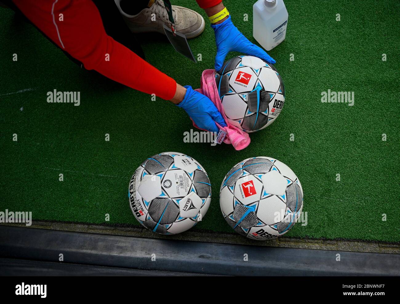 Footballs are disinfected during the Bundesliga soccer match between Duesseldorf and Paderborn in the Merkur Spiel-Arena, Duesseldorf, Germany. Stock Photo