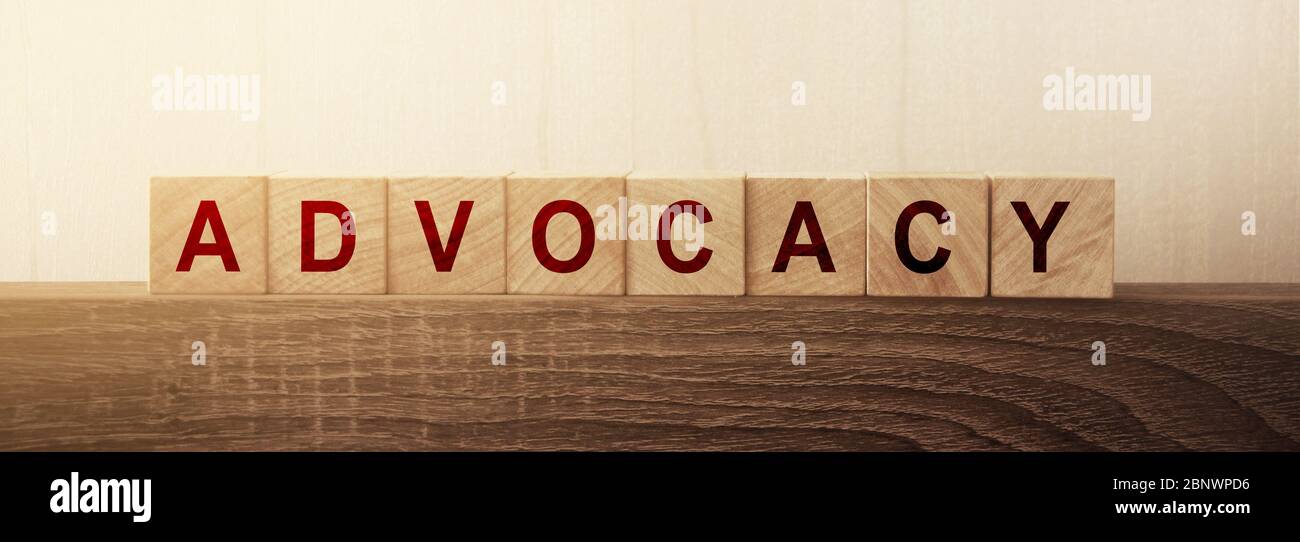 Advocacy Word on Wooden Cubes. Law, conflict solution and business regulation concept Stock Photo