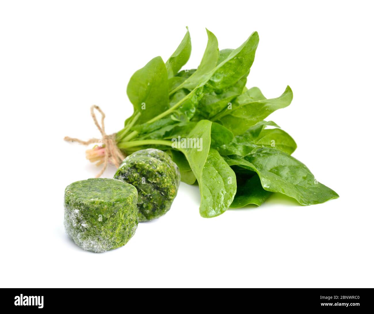 Fresh and Frozen Spinach leaves. Isolated on white background Stock