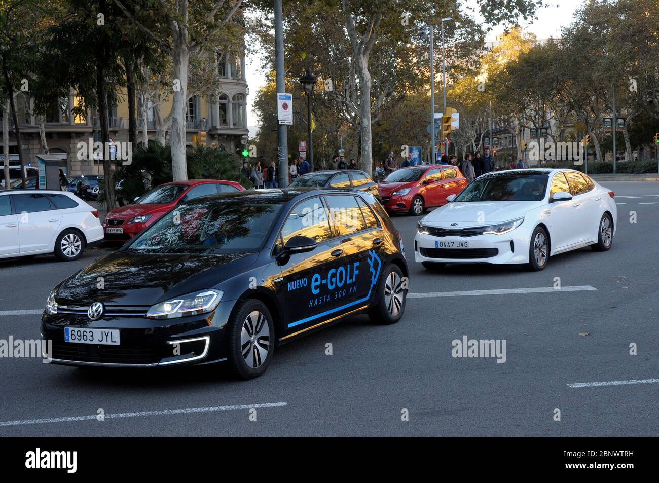 Electric vehicles circulating in Barcelona city Stock Photo