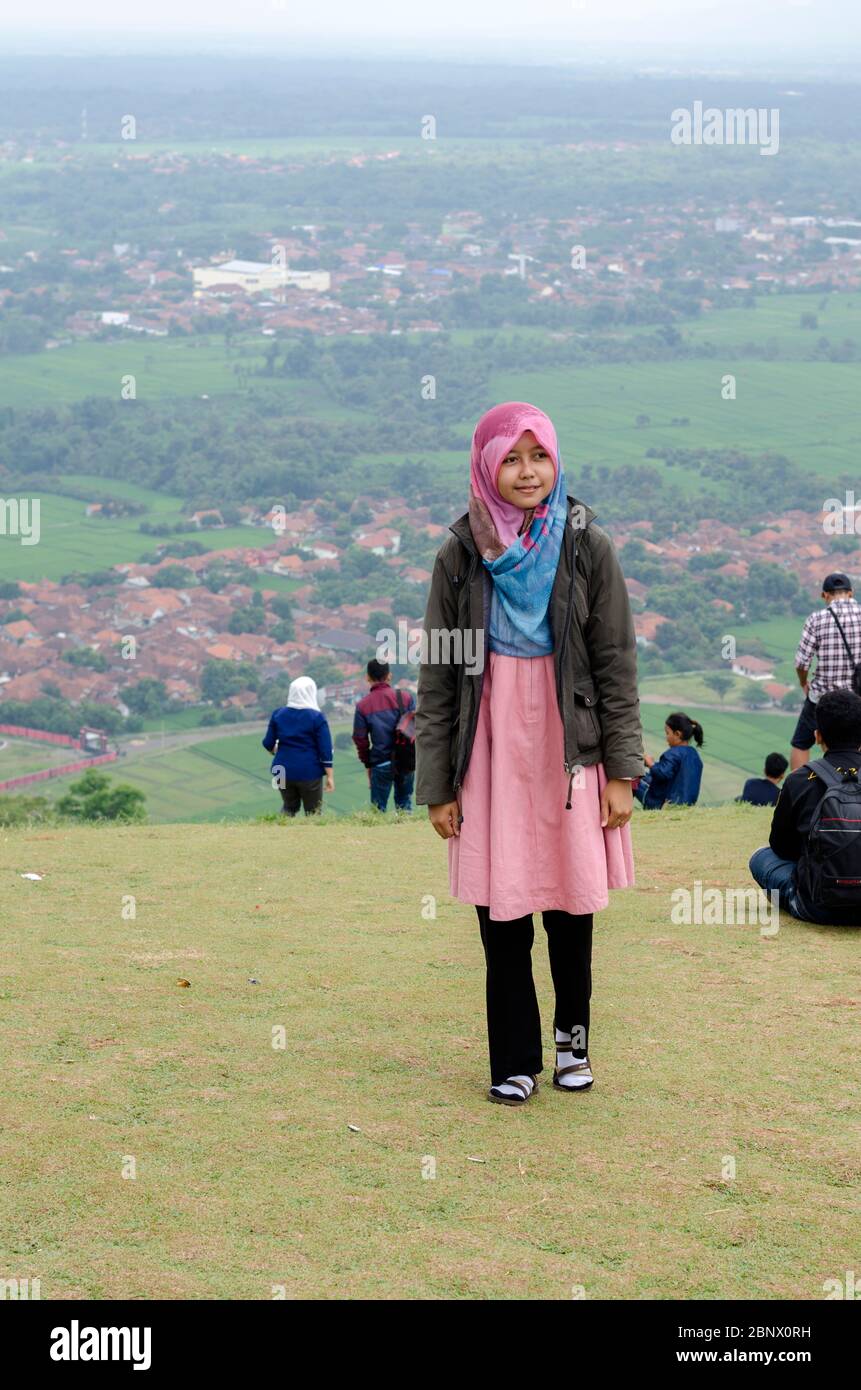 teenagers wear hijab and jackets alone Stock Photo