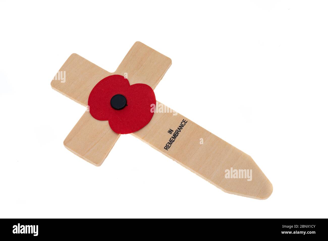 Red paper poppy on a remembrance day wooden cross - white background Stock Photo