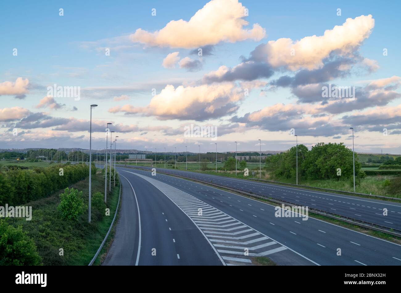 M56 motorway empty no cars devoid of traffic no travel lockdown essential travel only. The road is empty during the coronavirus lockdown May 2020, UK. Stock Photo