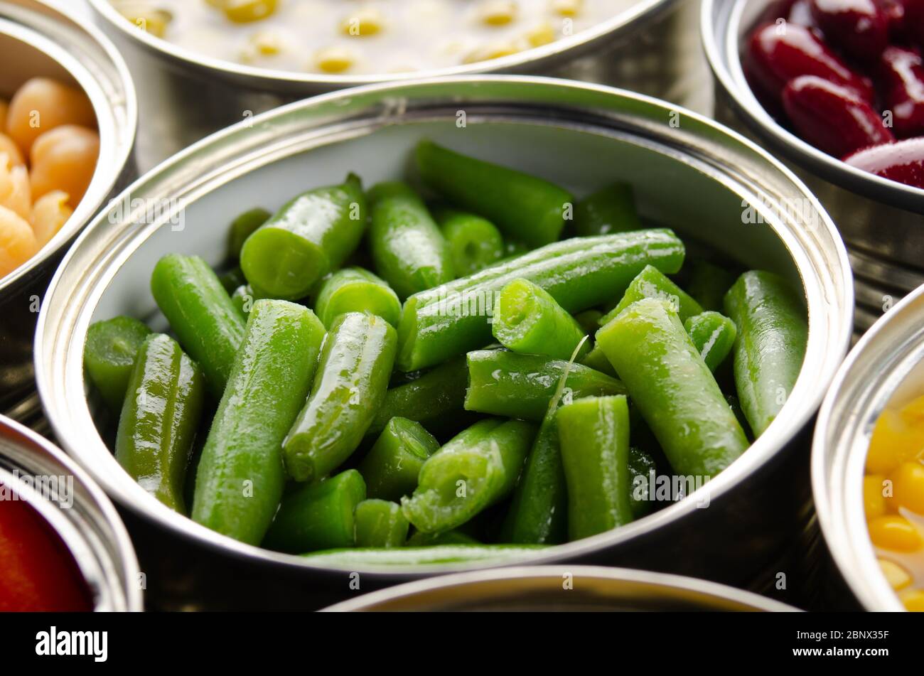 Canned green beans in just opened tin can. Non-perishable food Stock Photo