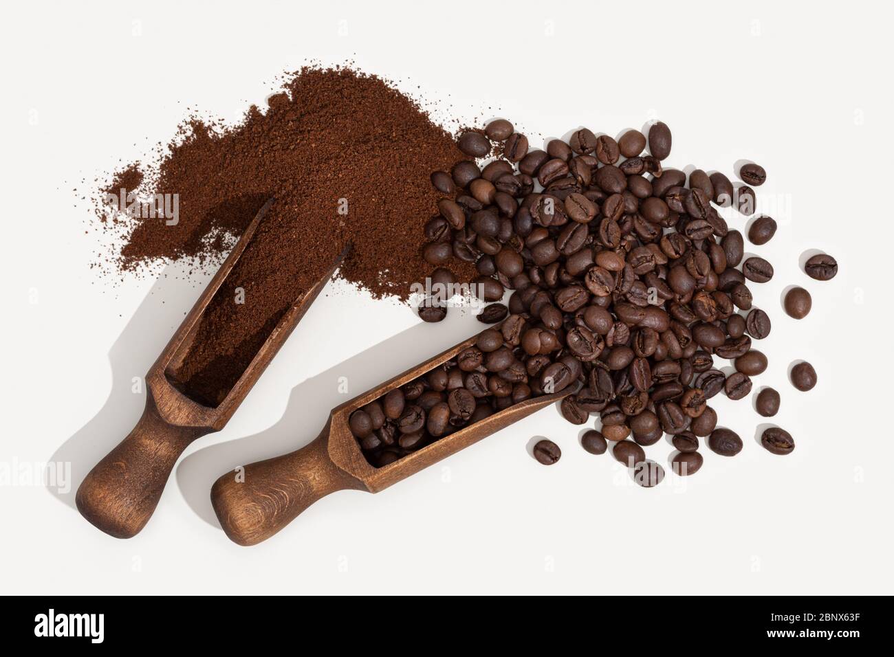 Roasted coffee beans and coffee ground isolated on white background. Top view Stock Photo