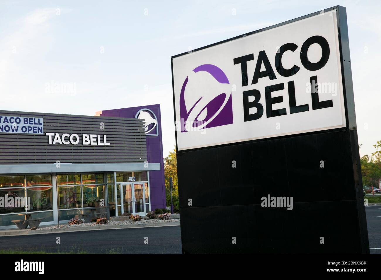 A logo sign outside of a Taco Bell restaurant location in Winchester, Virginia on May 2, 2020. Stock Photo