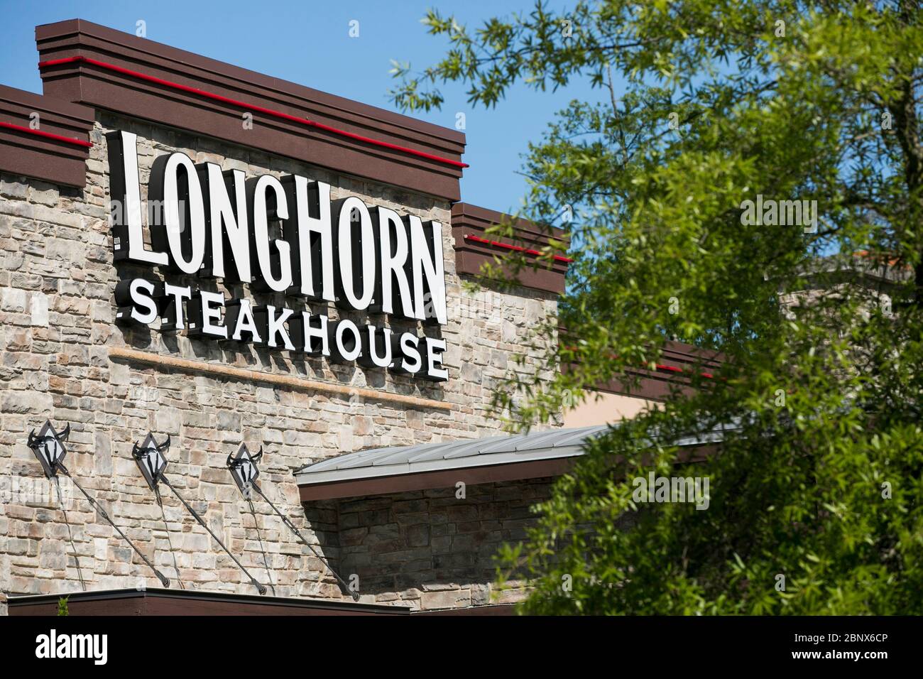 A logo sign outside of a LongHorn Steakhouse restaurant location in Newport News, Virginia on