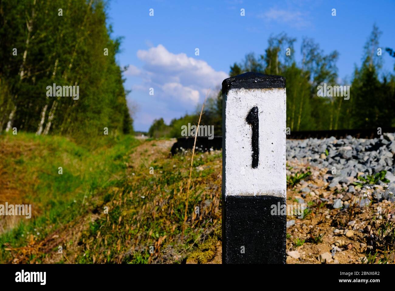 1 kilometer road sign distance indicator, 1 kilometer milestone, distance indicator Stock