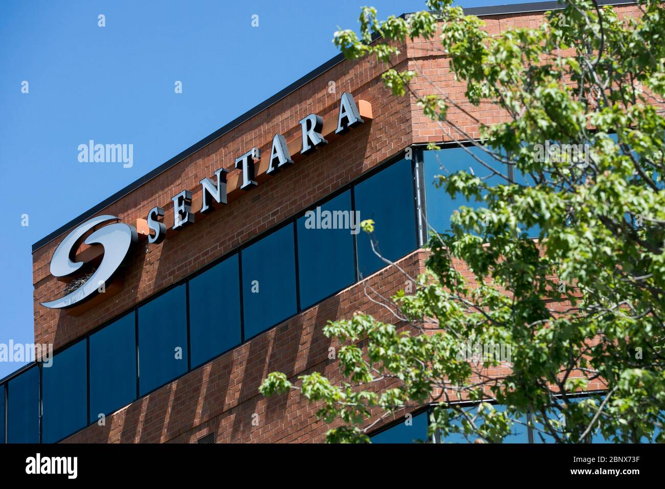 A logo sign outside of a facility occupied by Sentara Healthcare in A logo sign outside of a facility occupied by Sentara Healthcare in