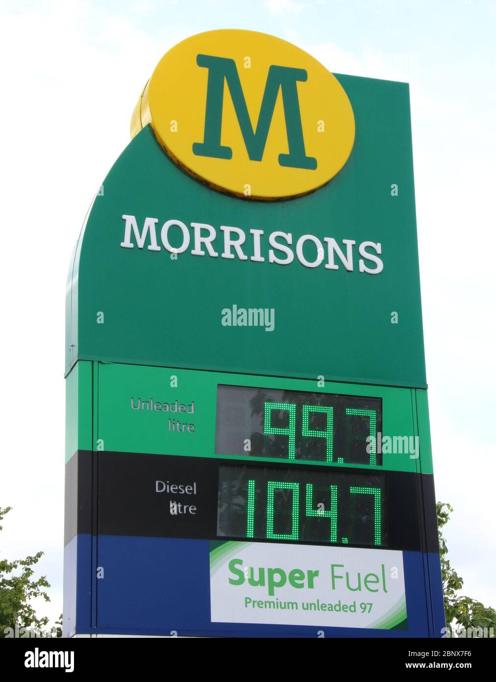 A Morrisons petrol station sells unleaded petrol at 99.7p per litre, the first time since 2016 petrol has been sold below £1 per litre.The global oil market crash triggered by the coronavirus lockdown has seen the crude oil price plummet to a near 20-year low. Now, led by UK Supermarket chains, Unleaded petrol is now on sale throughout the country at below £1 per litre. Stock Photo