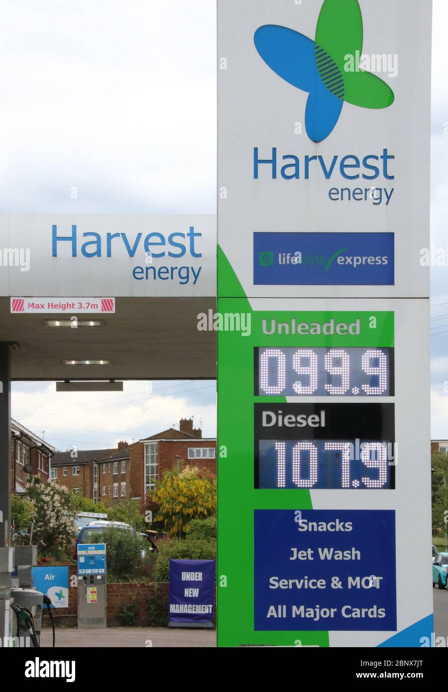 A Harvest Energy petrol station sells unleaded petrol at 99.9p per litre, the first time since 2016 petrol has been sold below £1 per litre.The global oil market crash triggered by the coronavirus lockdown has seen the crude oil price plummet to a near 20-year low. Now, led by UK Supermarket chains, Unleaded petrol is now on sale throughout the country at below £1 per litre. Stock Photo