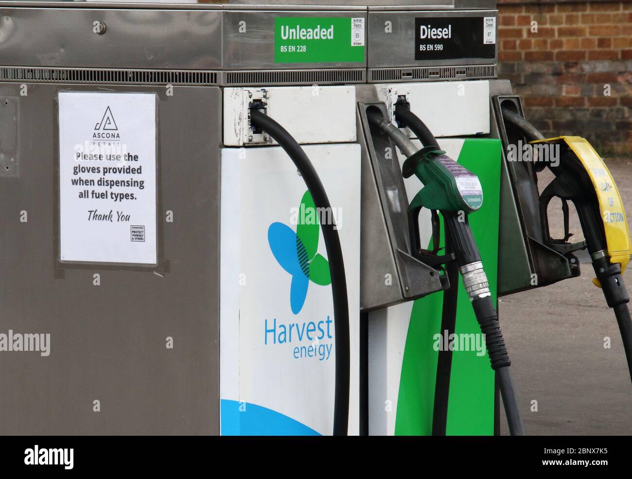 Petrol pumps at a Harvest Energy petrol station selling unleaded petrol