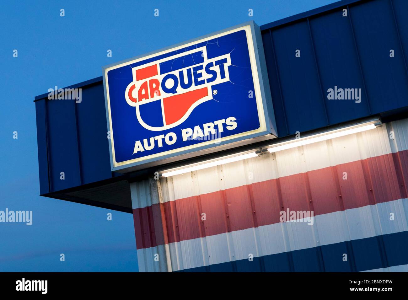 A logo sign outside of a Carquest Auto Parts retail store location in