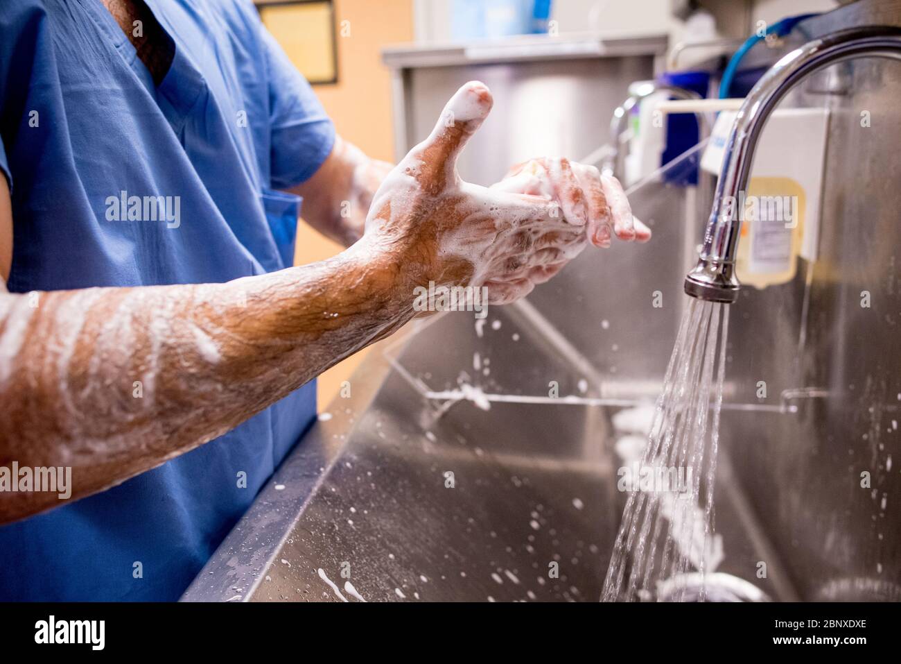 Covid-19 pandemic hand washing by medical professionals Stock Photo