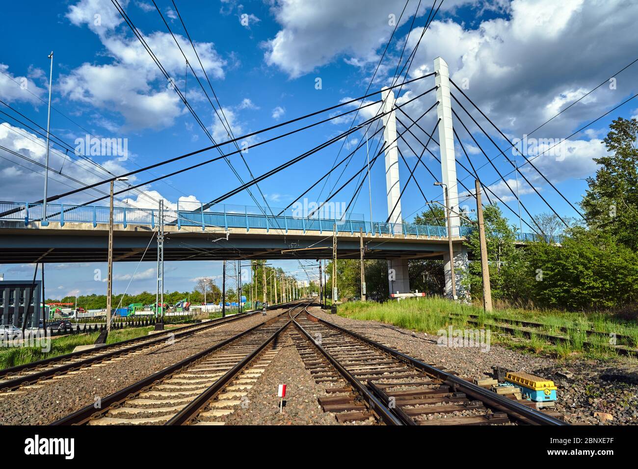 Cable-stayed road bridge over railway tracks in Poland Stock Photo - Alamy