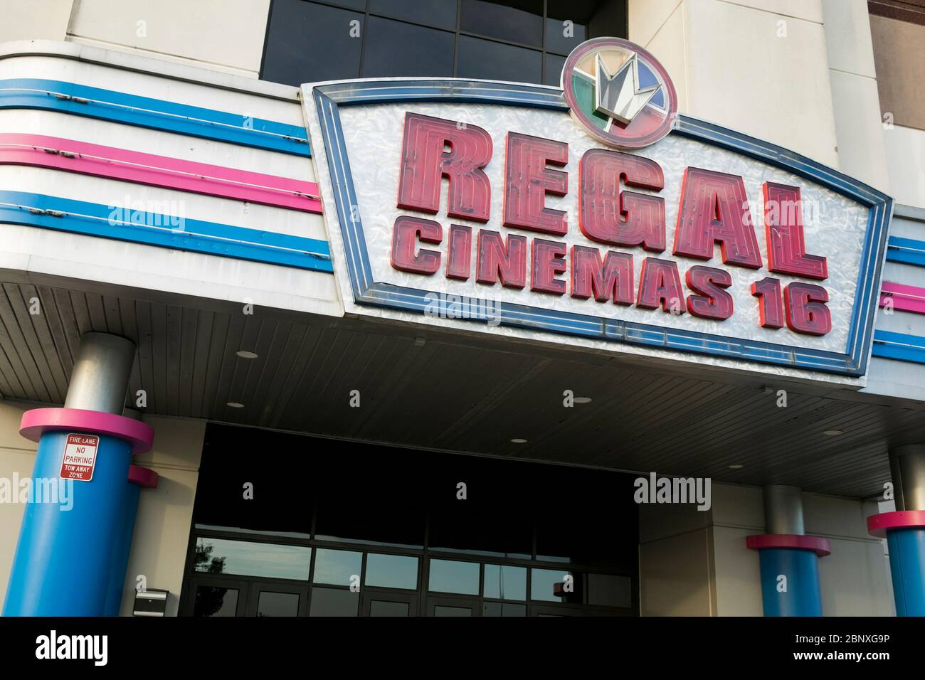 A logo sign outside of a Regal Cinemas movie theater location in