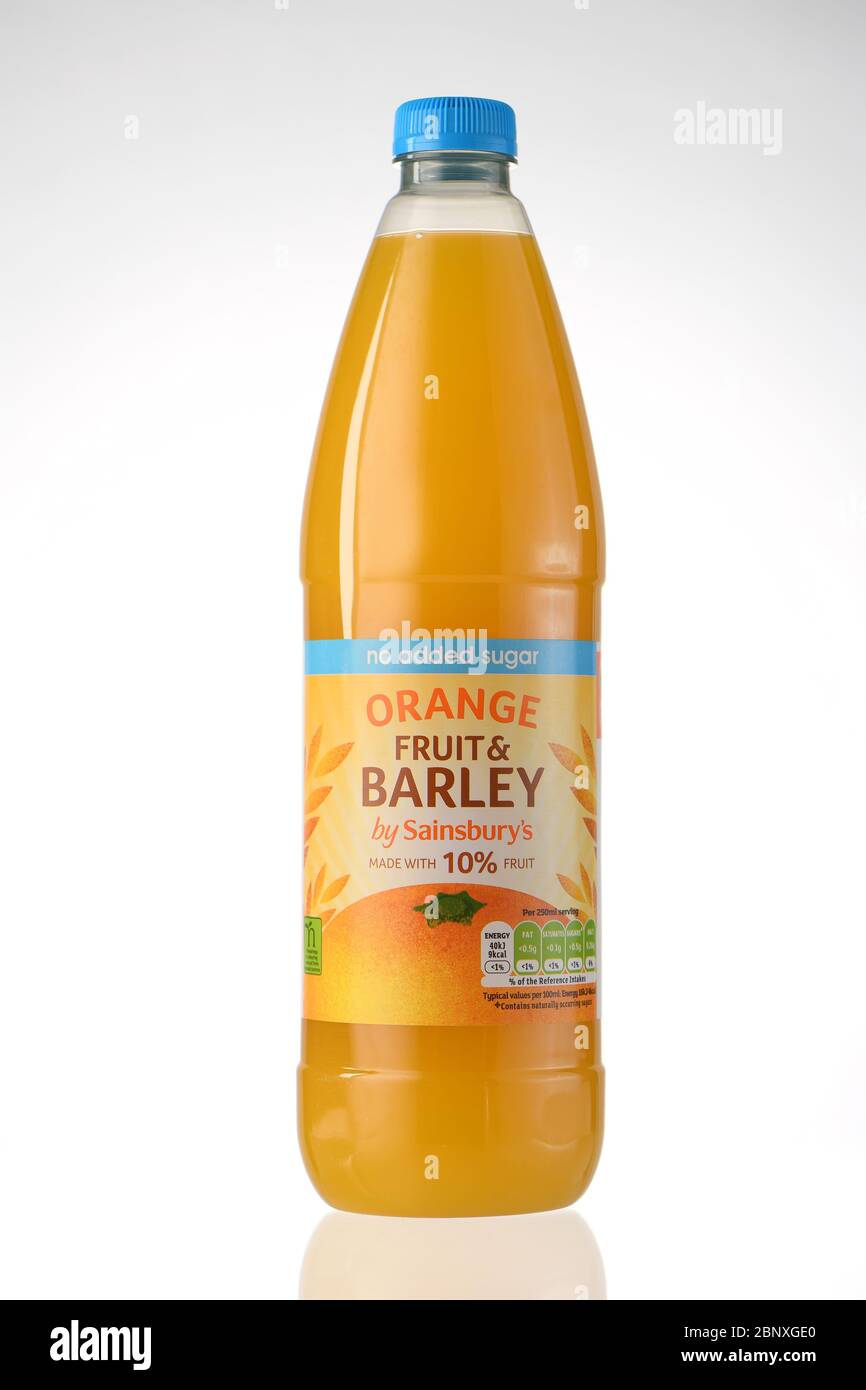 Sainsburys orange fruits barley squash drink shot in studio isolated against a white background. Stock Photo