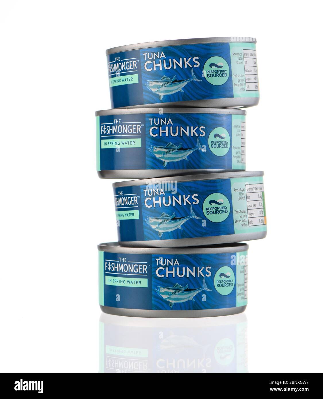 The fishmonger tuna chunks in spring water tin isolated on a white ...