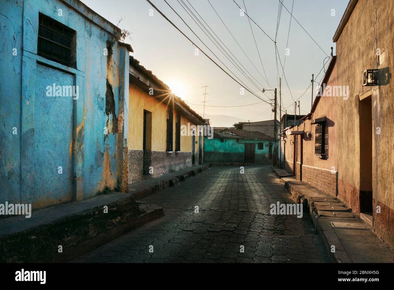 Peaceful street scene with colourful houses in central Quetzaltenango (Xela), Guatemala. Mar 2019 Stock Photo