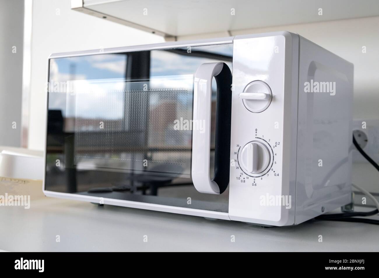 Microwave oven in fast food shop and restaurant. Close up Stock Photo