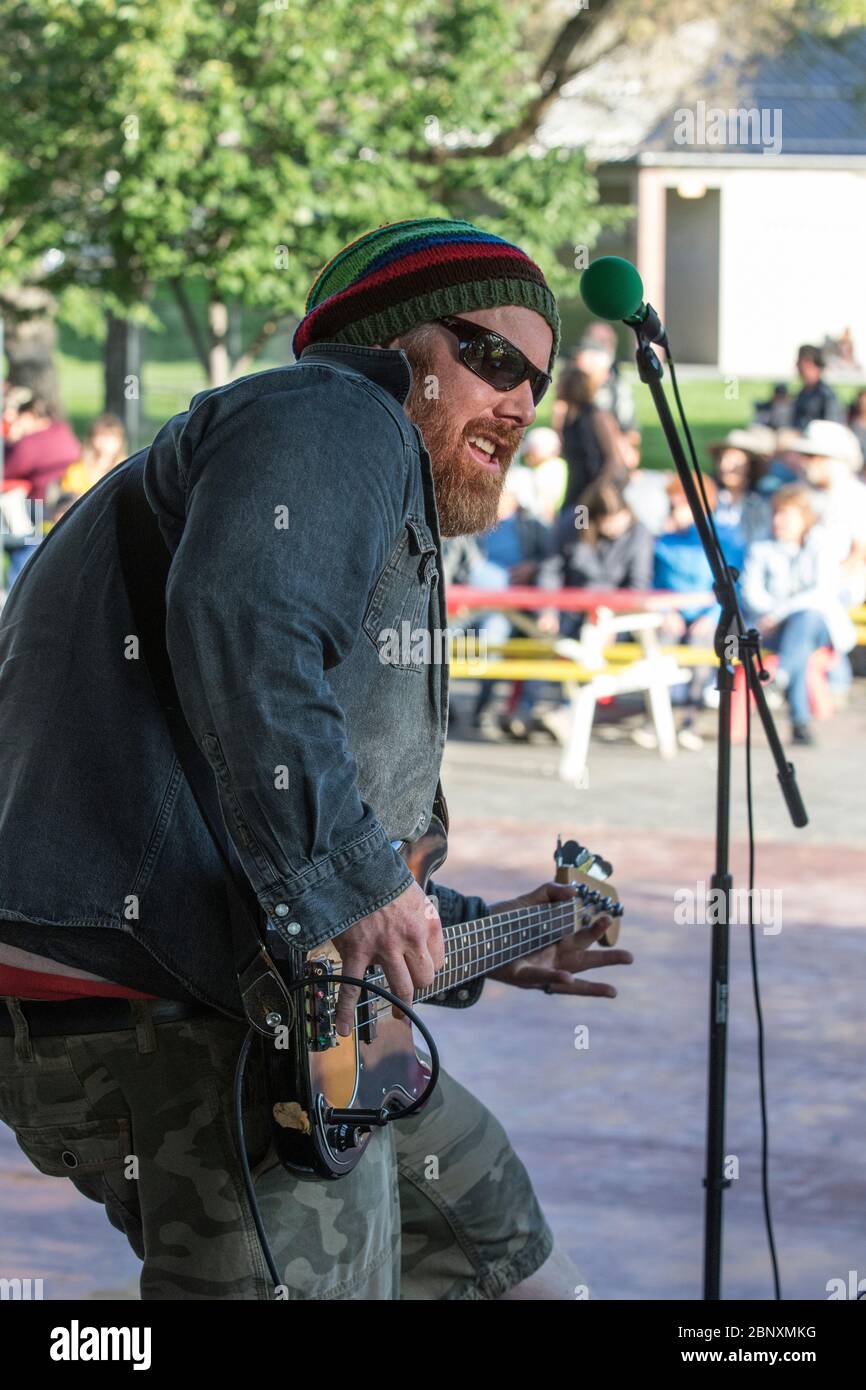 Bass guitar man playing bass guitar park hires stock photography and