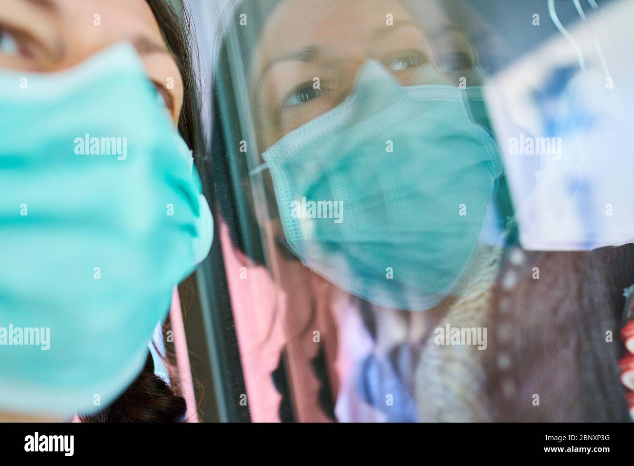 Pfaffenhofen, Germany, 16th of May, 2020. Woman with mouth protection against a corona infection. © Peter Schatz / Alamy Stock Photos Stock Photo