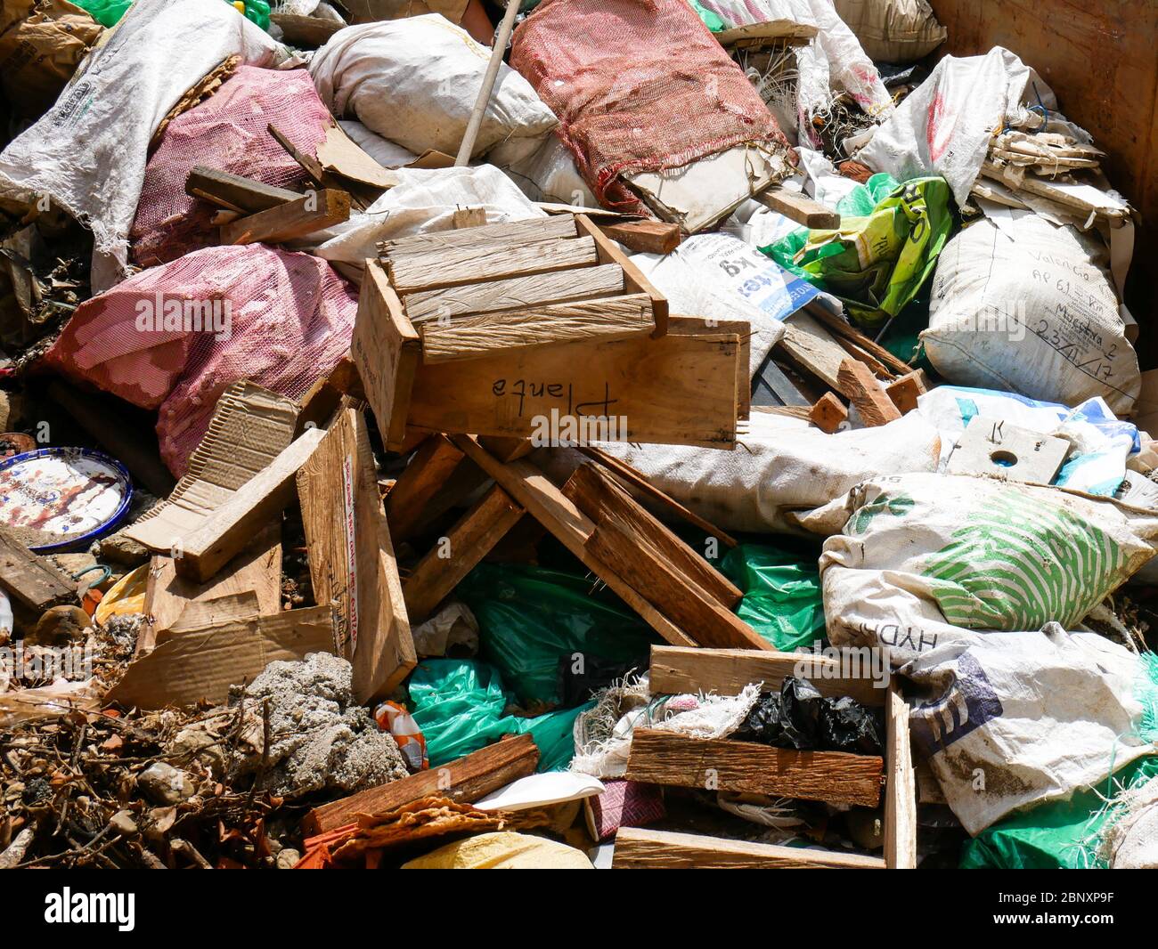 Pile of construction and demolition solid waste inside a container ready to be disposed on a special site solid waste management Stock Photo