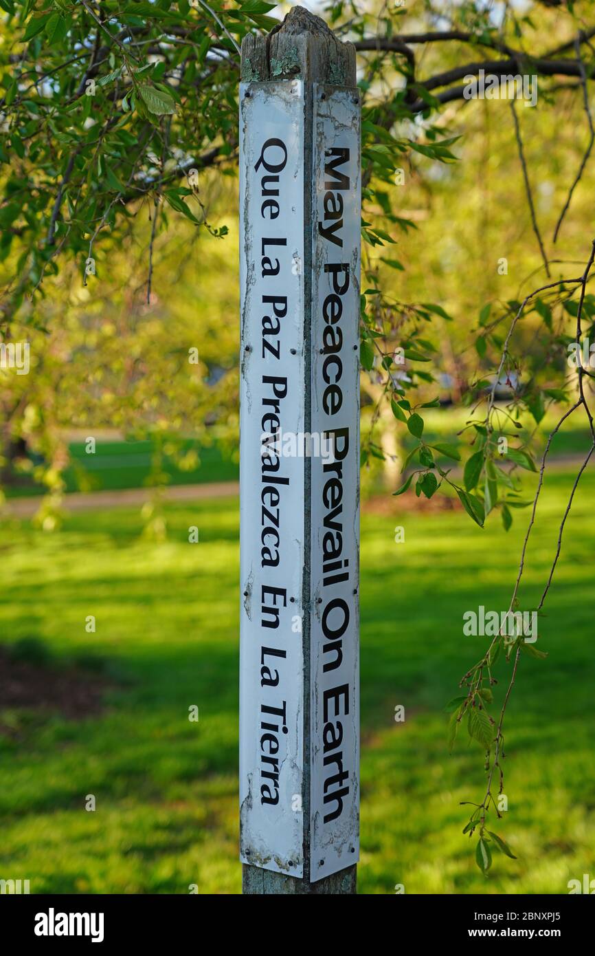 PRINCETON, NJ -22 APR 2020- View of a Peace Pole, a monument displaying the message "May Peace Prevail on Earth” in several languages in Princeton, Ne Stock Photo