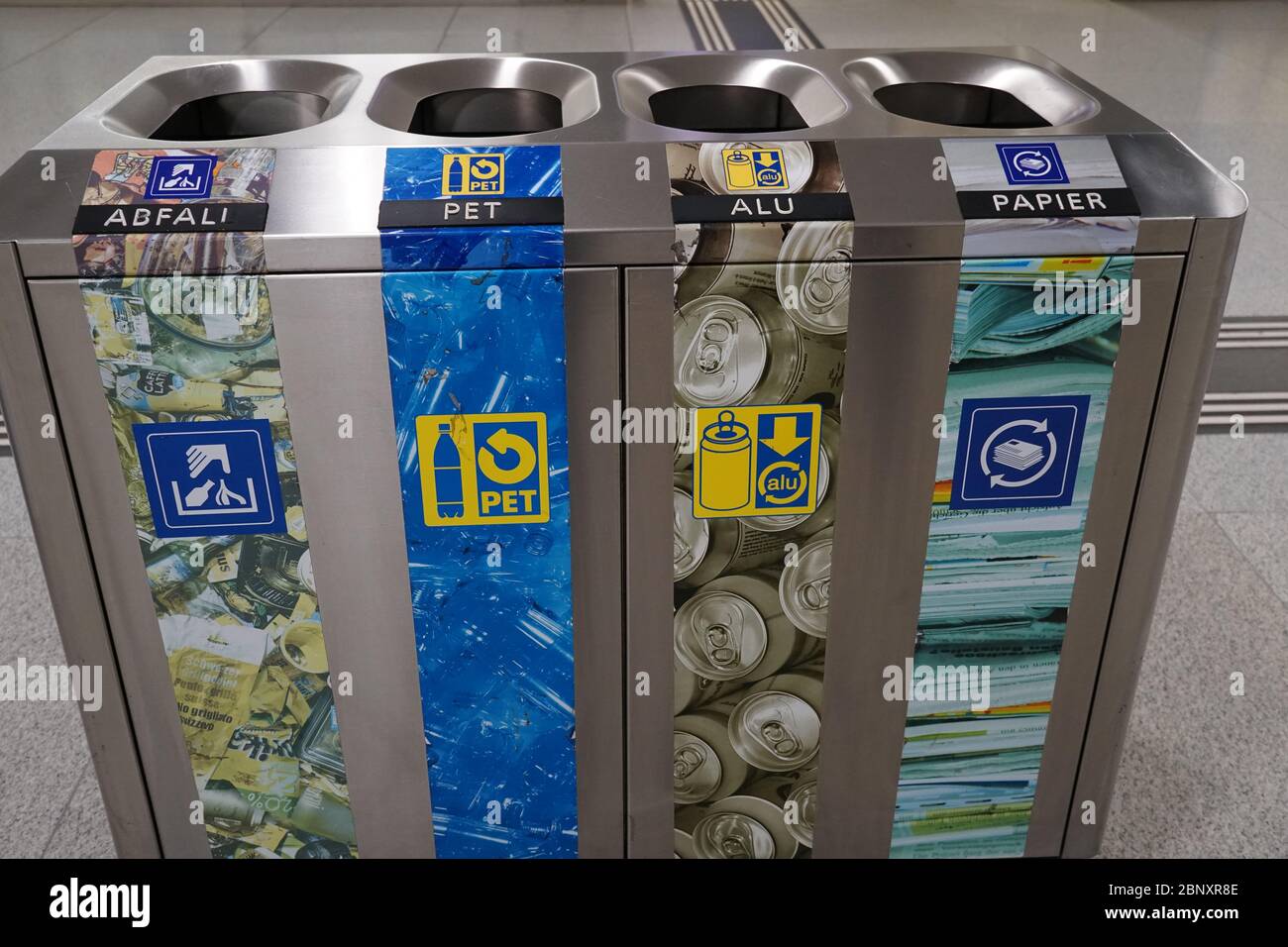 the separation of waste on main train station in Zurich, in four categories, general waste, plastic, aluminium and paper. Stock Photo