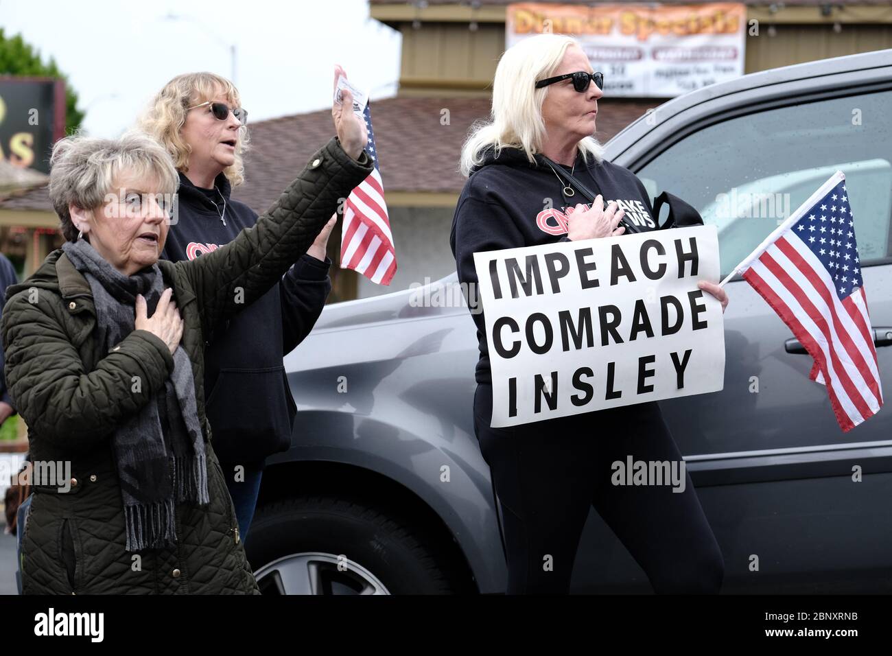 Vancouver, USA. 16th May, 2020. Protesters gather to show support for Kelly Carroll who officially opened her business, The Pet Biz, a luxury pet grooming operation in Vancouver, Wash., on May 16, 2020. The opening is a direct violation of Governor Jay Inslee's orders for non-essential business to remain closed at this time, but Kelly, who has already been operational for five days, insists she need to open to support her grand-daughters. (Photo by Alex Milan Tracy/Sipa USA) Credit: Sipa USA/Alamy Live News Stock Photo