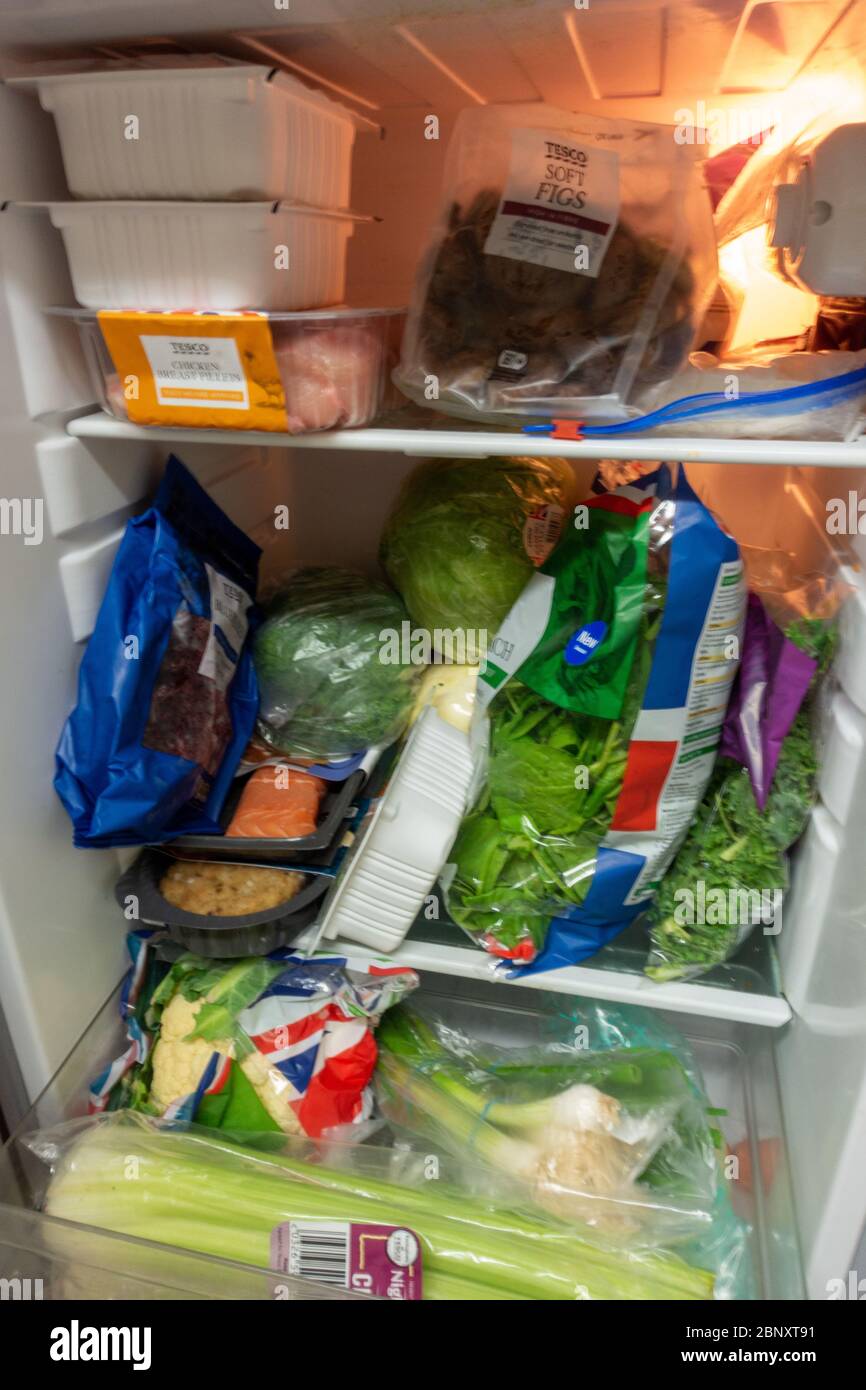tightly packed small fridge with healthy food Stock Photo