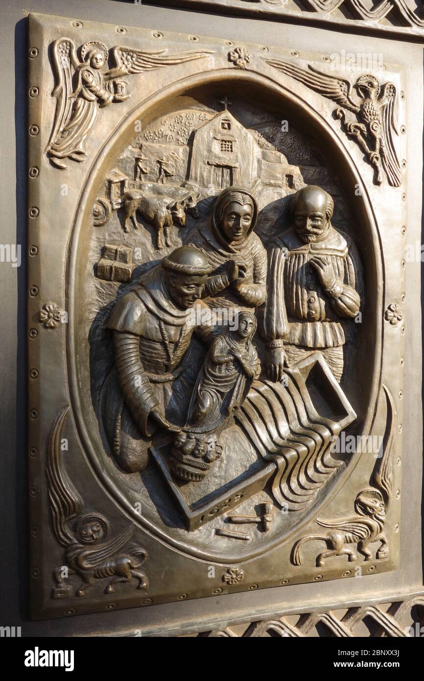 Detail of La Conquistadora on a bronz plaque on entrance door to the Cathedral Basilica of Saint Francis of Assisi in Santa Fe, NM. Stock Photo