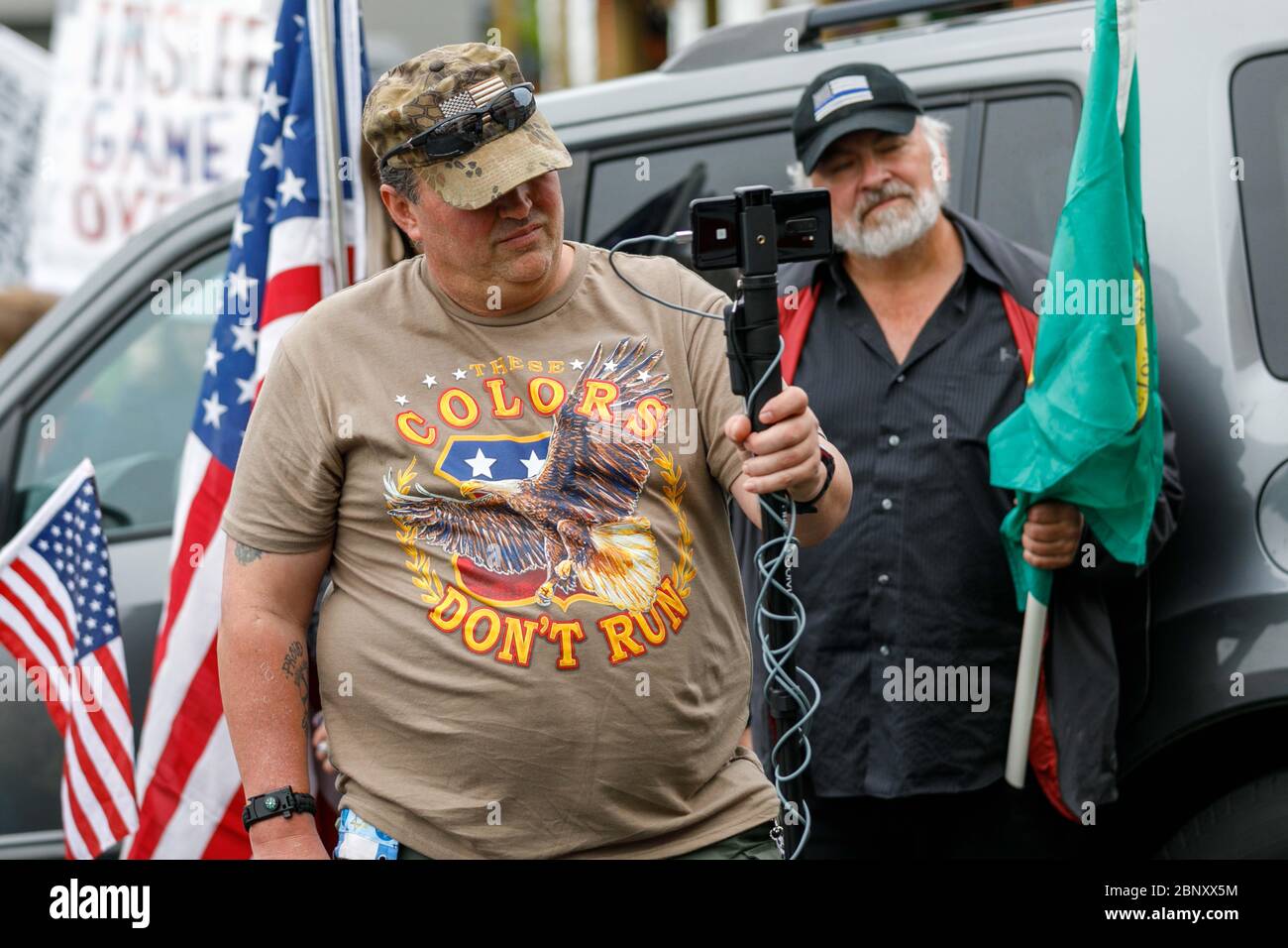 Vancouver, USA. 16th May, 2020. About 100 demonstrators rallied along with Patriot Prayer, Three Percenters, and pro-Trump groups to support early reopening of PetBiz, a pet-grooming salon, in Vancouver, Washington on May 16, 2020. (Photo by John Rudoff/Sipa USA) Credit: Sipa USA/Alamy Live News Stock Photo