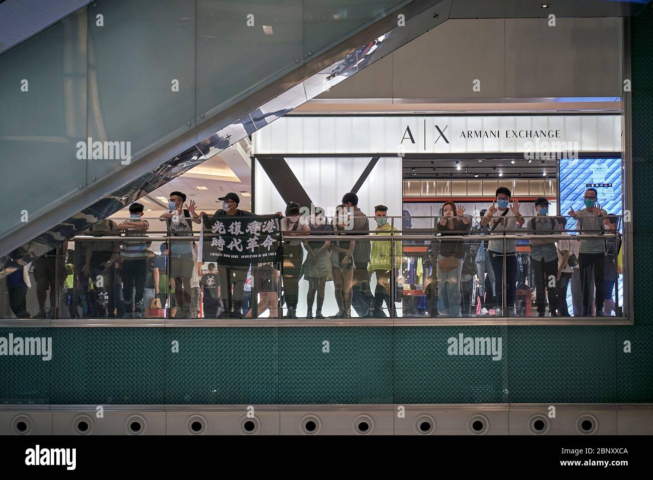 leeg Aanvrager graven Demonstrators wearing facial masks are seen displaying a protest banner  reading “Liberate Hong Kong; revolution of our times” during the protests.Anti-government  protesters gathered in a mall at the New Town Plaza after