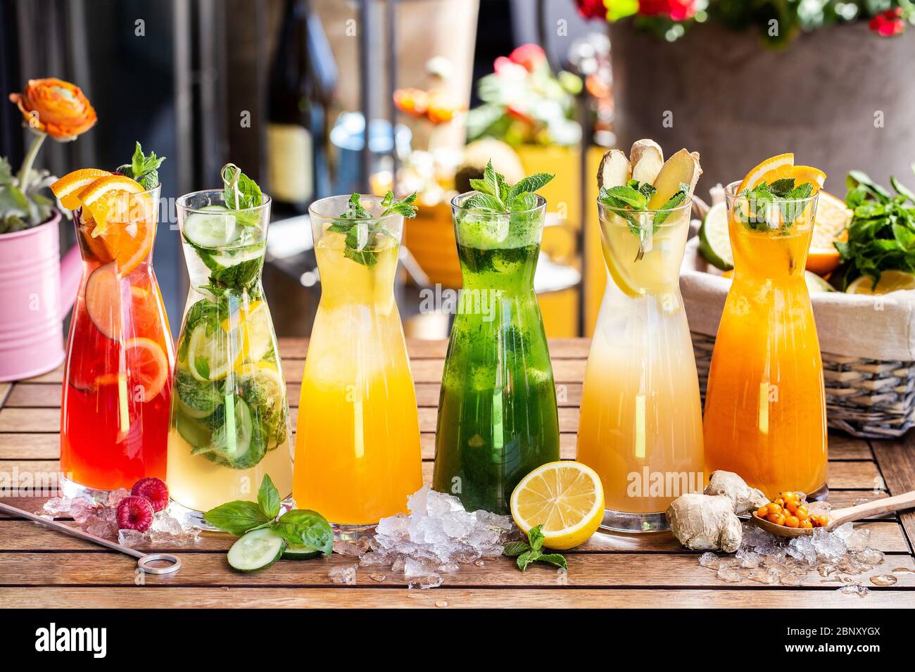 Fruits and vegetables drink, juice, smoothie. Summer party beverages. Orange, cucumber, lemon, ginger, mint Stock Photo