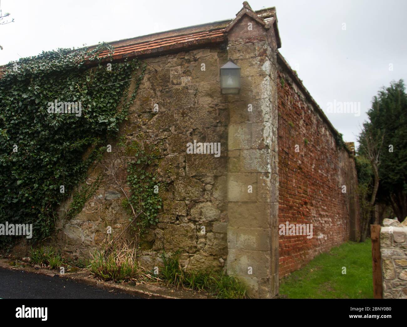Appuldurcombe Park Walled Garden -  where the wall on view from the approach is  smartened  with a stone facing Stock Photo