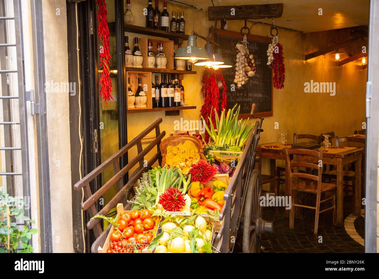 Entrance to Italian restaurant in Rome with vegetables, fruit and