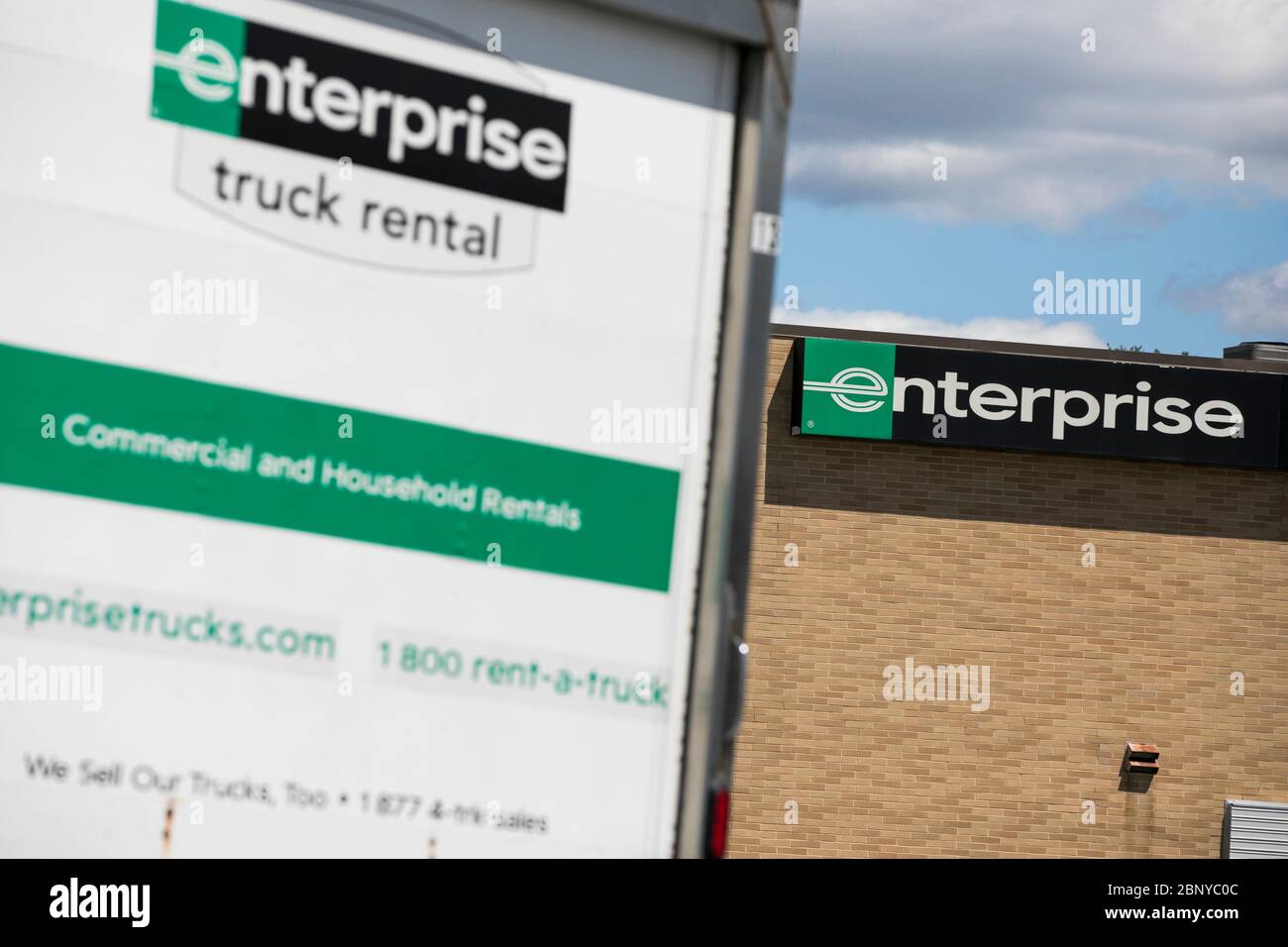 Logo signs on trucks outside of a Enterprise Truck Rental location in