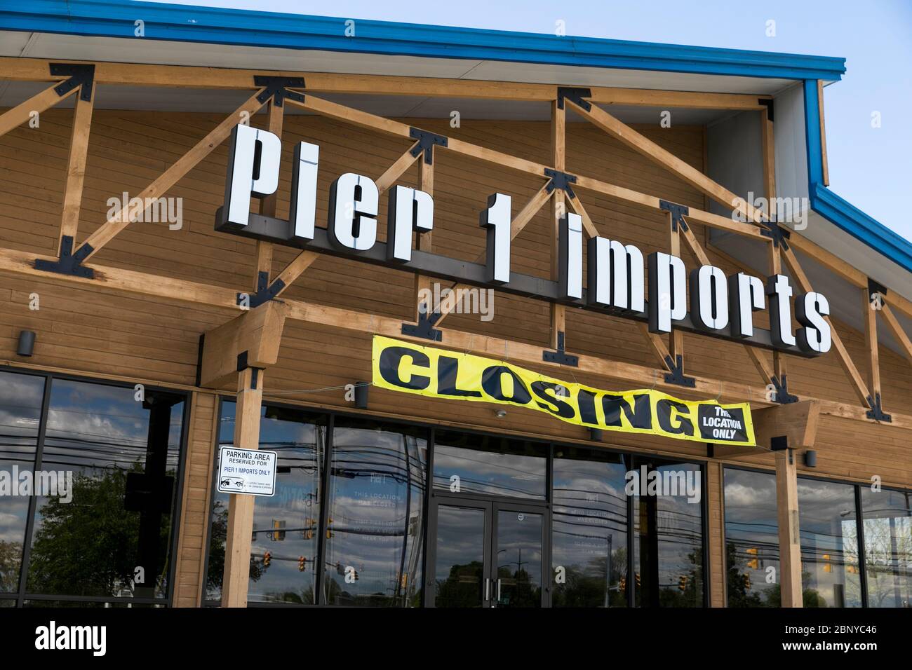 A logo sign outside of a Pier 1 Imports retail store location with a
