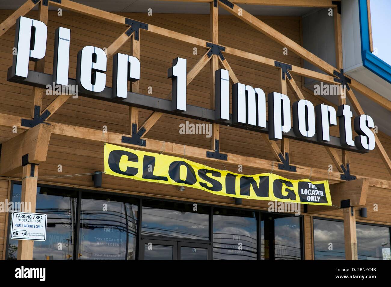A logo sign outside of a Pier 1 Imports retail store location with a