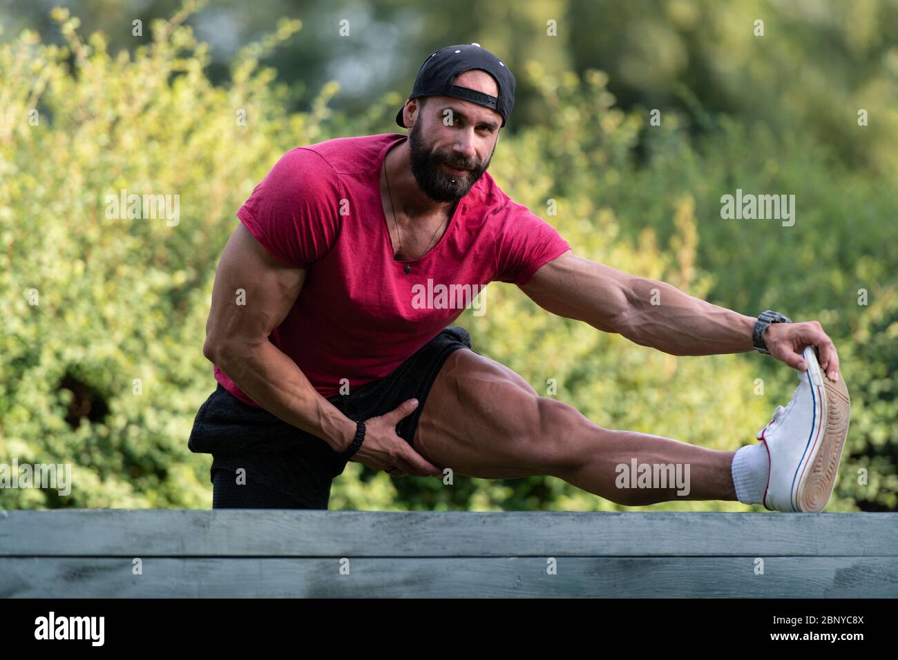 Guy stretching body muscles on hi-res stock photography and images - Alamy