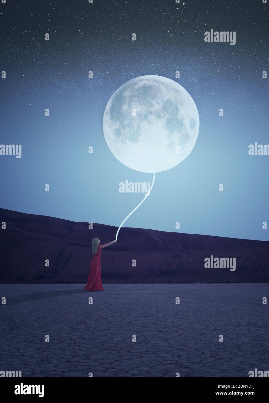 Night scene of a woman in red dress holding a glowing rope attached to ...