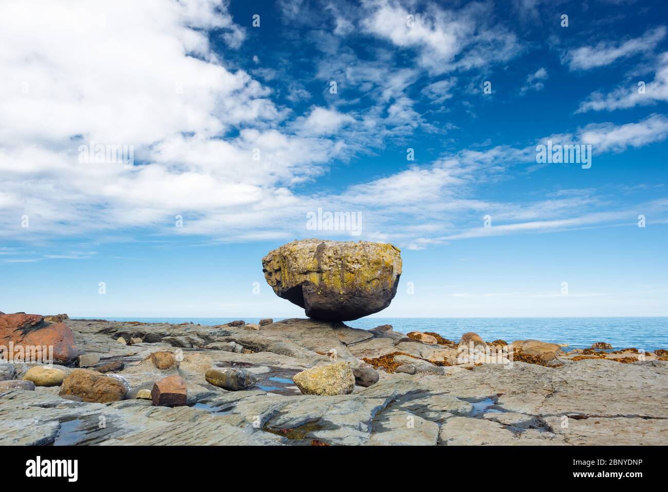 Balance Rock, a popular tourist destination in Haida Gwaii, British Columbia, Canada Stock Photo