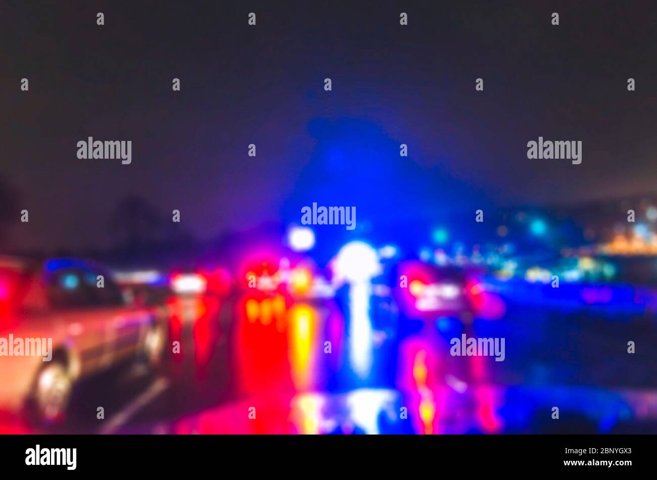 lighting of police car in the night during accident on the road . -blurred. Stock Photo